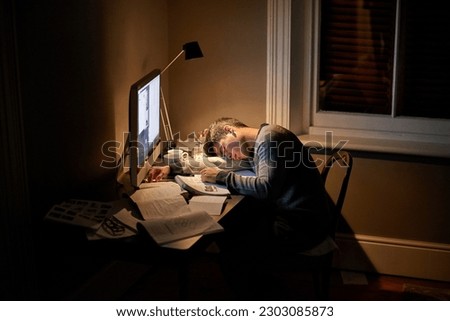 Student, university and sleeping or studying late into the night on screen or fatigue on table and reading for examination. Tired, research and hard work for test paper or computer at college Royalty-Free Stock Photo #2303085873