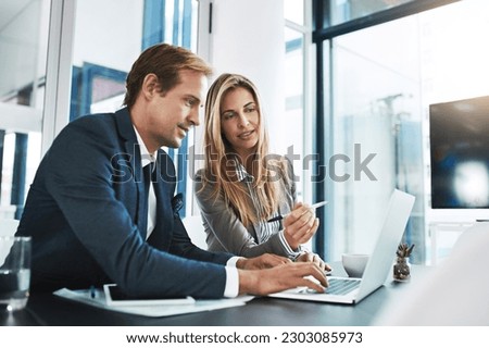 Man, woman and laptop with corporate partner, planning or typing for project, proposal and company vision. Businessman, partnership and computer with discussion, teamwork and consulting with analysis Royalty-Free Stock Photo #2303085973