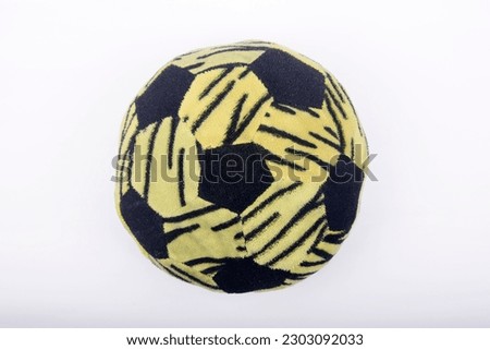 Pillow in the shape of a soccer ball, green and black