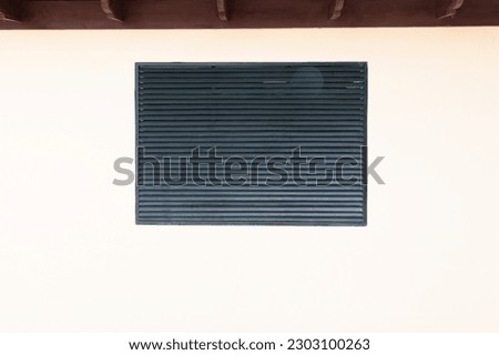louvers shutter on the wall. louvers shutter facade. louvers shutter exterior. Royalty-Free Stock Photo #2303100263