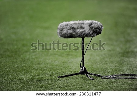 Professional boom microphone for live sport broadcasting on soccer field