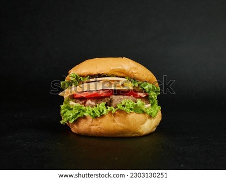 hamburger on a black background look interesting