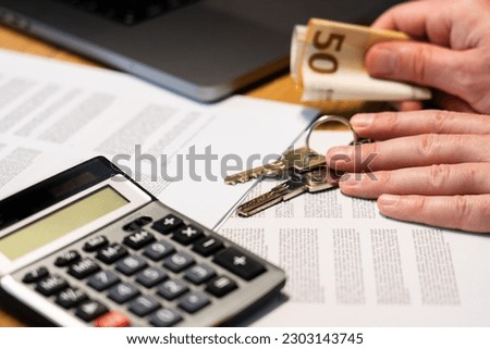 Financial documents. A banknote with a calculator in the background. Euro currency.