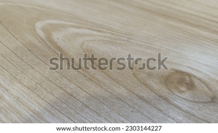 Embrace the timeless charm of this captivating photograph featuring a rustic wood motif. The intricate patterns and textures of the wood grain are beautifully captured, offering a versatile backdrop f