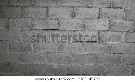 Texture of old concrete block wall background. cement block (batako).Walls made of batako. Batako is a brick made from a mixture of cement, sand, and gravel

