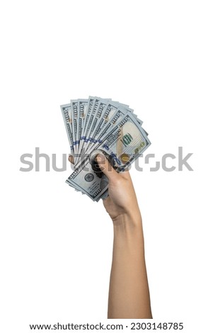 Woman hand holding money in dollars isolated on white background with clipping path. Full Depth of field. 