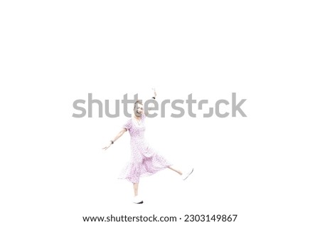 Photograph of a woman in a pink dress jumping for joy on a white background