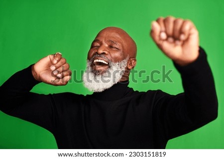 Happy, dance and face of of black man on green screen for celebration, music or excited. Happiness, smile and energy with senior person dancing isolated on studio background for freedom and movement