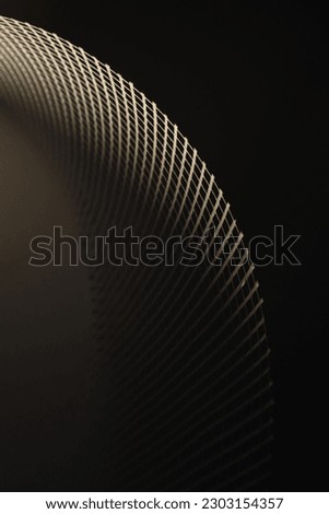 Abstract white curved shape with dark background. Background and texture of net. background and texture of grid.  