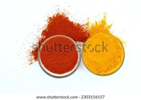 turmeric powder and red chilli powder stock image