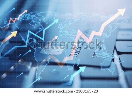 Close up of laptop and bank card with growing arrows and map on blurry background. Growth, success and money concept. Double exposure