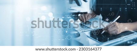 Medical Research, Health technology, Healthcare and medicine concept. Technician using digital tablet, studying chemical elements in hospital laboratoty with medical icons, microbiology