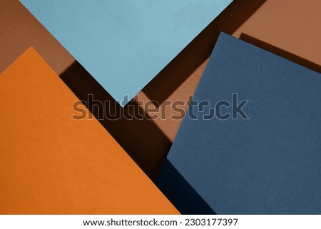 Paper for pastel overlap in orange, blue and brown colors for background, banner, presentation template. Creative trendy background design in natural colors. Background in 3d style. Royalty-Free Stock Photo #2303177397