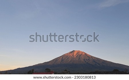 A gorgeous active volcano named Mount Kerinci (gunung kerinci) that has the heigh of 3.805 masl is the tallest Indonesia volcano mountain located at kerinci region, Jambi province, Sumatra island   Royalty-Free Stock Photo #2303180813