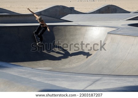 Unidentified girl skating alone in Venice Beach skate park in Los Angeles
