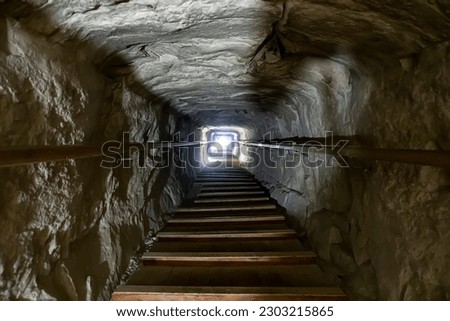 Stairway of the tomb in the center of a Pyramid of Snefru, Dahshur. Cairo. Egypt. light at the end of the tunnel. The Afterlife of the ancient Egyptian Pharaohs Royalty-Free Stock Photo #2303215865