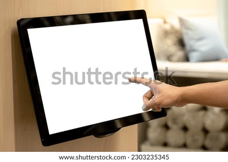 Using interactive touchscreen display in home decoration store. Male customer hand touching on LCD touch screen monitor on the wall for browsing information in furniture design shop. Royalty-Free Stock Photo #2303235345