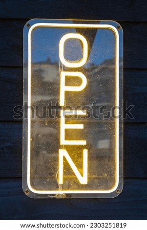 Close-up of a neon OPEN sign.