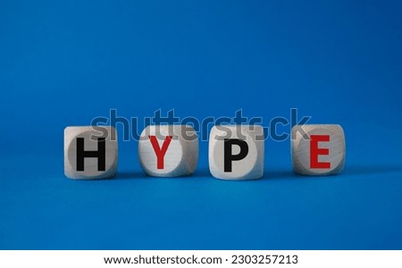 Hype symbol. Concept word Hype on wooden cubes. Beautiful blue background. Business and Hype concept. Copy space.