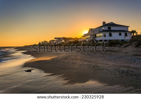Sunset over beachfront homes at Edisto Beach, South Carolina. Royalty-Free Stock Photo #230325928