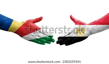 Handshake between Egypt and Seychelles flags painted on hands, isolated transparent image.