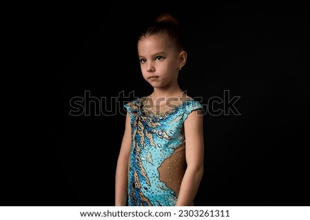 Portrait of young gymnast girl. Cute girl professional rhythmic gymnast