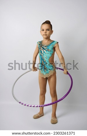 Portrait of young gymnast girl. Cute girl professional rhythmic gymnast