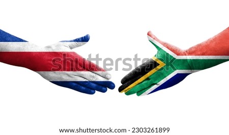 Handshake between South Africa and Costa Rica flags painted on hands, isolated transparent image.