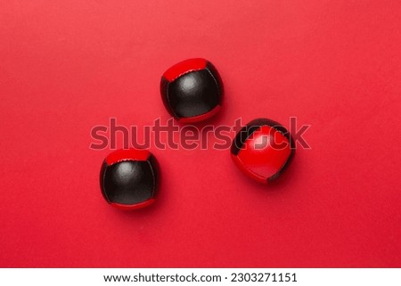 Colorful juggling ball on color background, top view