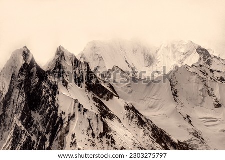 landscape of snow caped peaks mountains of Karakorum range, snow mountains in northern Pakistan, landscape of snow mountains with glaciers , largest snow range after pools 