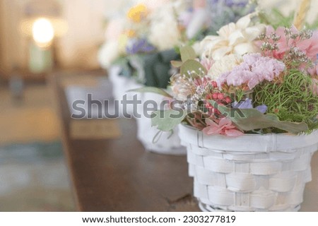 A flower basket of dried flowers photographed with bright natural light Royalty-Free Stock Photo #2303277819