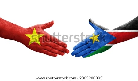 Handshake between South Sudan and Vietnam flags painted on hands, isolated transparent image.