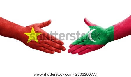 Handshake between Maldives and Vietnam flags painted on hands, isolated transparent image.