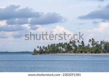 A peaceful resort under coconut trees.