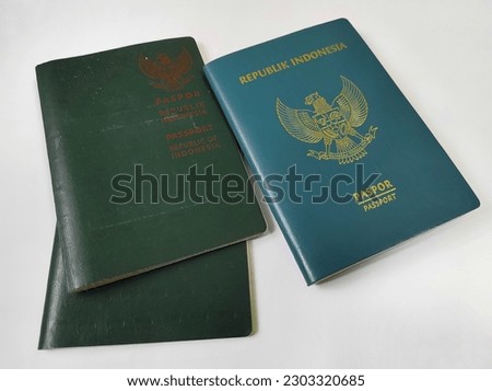 Green passport of the Republic of Indonesia, new and old isolated on white background.