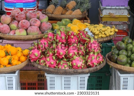 Fruits such as dragon fruit, mango, pineapple, tangerine, orange, watermelon, tamarind are sold at Dam market, Nha Trang, Khanh Hoa