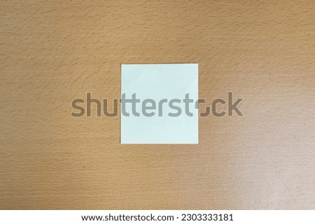 blank note on wooden desk concept