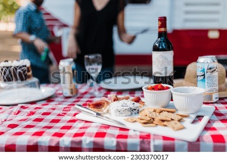 Preparing a Fancy Meal at a Campground with Gourmet Snacks