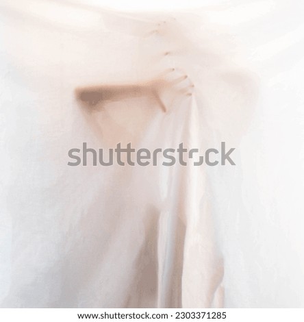 mysterious female hands hidden behind a white sheet Royalty-Free Stock Photo #2303371285