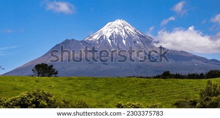 A view a Taranaki on the southern side of the volcano. Taranaki is a volcano on the south western part of the North Island of New Zealand. One a clear day it can be seen all the way from Tongariro.  Royalty-Free Stock Photo #2303375783