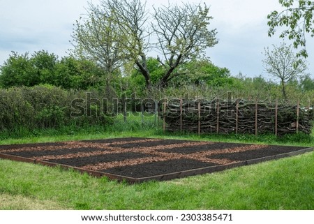 Create a new bed in the garden on a lawn, No Dig gardening method, Royalty-Free Stock Photo #2303385471