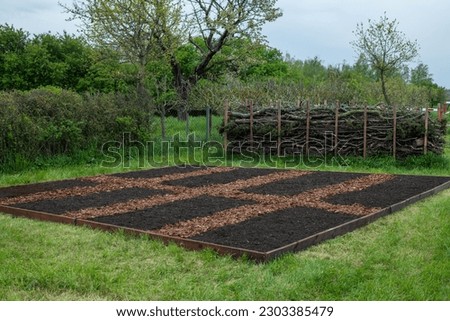 Create a new bed in the garden on a lawn, No Dig gardening method, Royalty-Free Stock Photo #2303385479