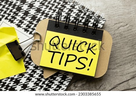 Quick Tips text on notepad with yellow sticker
