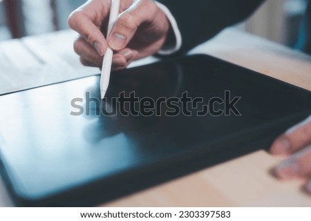 Electronic document and signature, Business and technology concept. Businessman working on digital tablet signing contract with digital pen signing ar writing on tablet screen