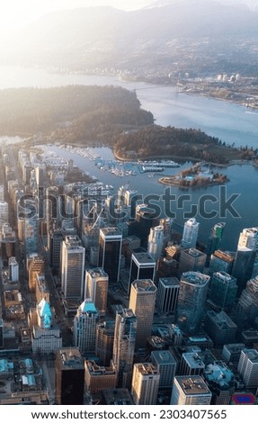 Downtown Vancouver, British Columbia, Canada. Modern City on West Coast of Pacific Ocean. Aerial View from Airplane. Royalty-Free Stock Photo #2303407565
