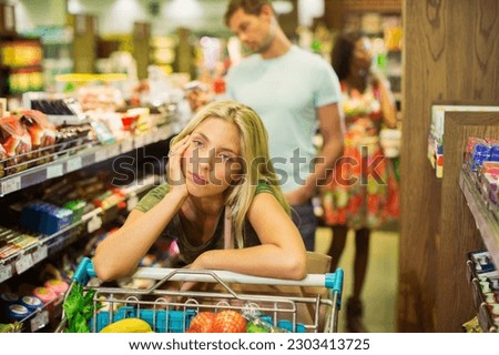 Bored woman shopping in grocery store