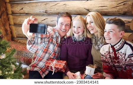Family taking picture together on christmas