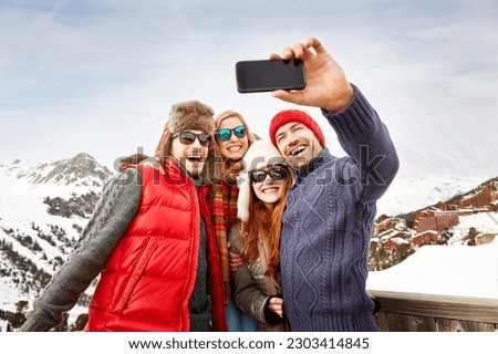 Friends taking picture together in the snow