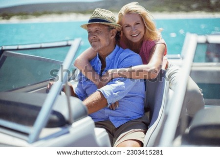 Older couple relaxing on boat Royalty-Free Stock Photo #2303415281