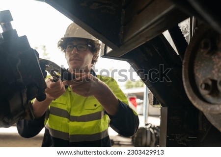 Production engineers are assisting adjusting and maintaining factory machine, Male workers technician examining control the industrial technology tool, professional repair men work in industry plant